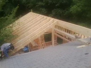 Framing a new roof addition that ties into an existing shingle roof in Allenport